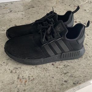 All black Adidas NMD R1